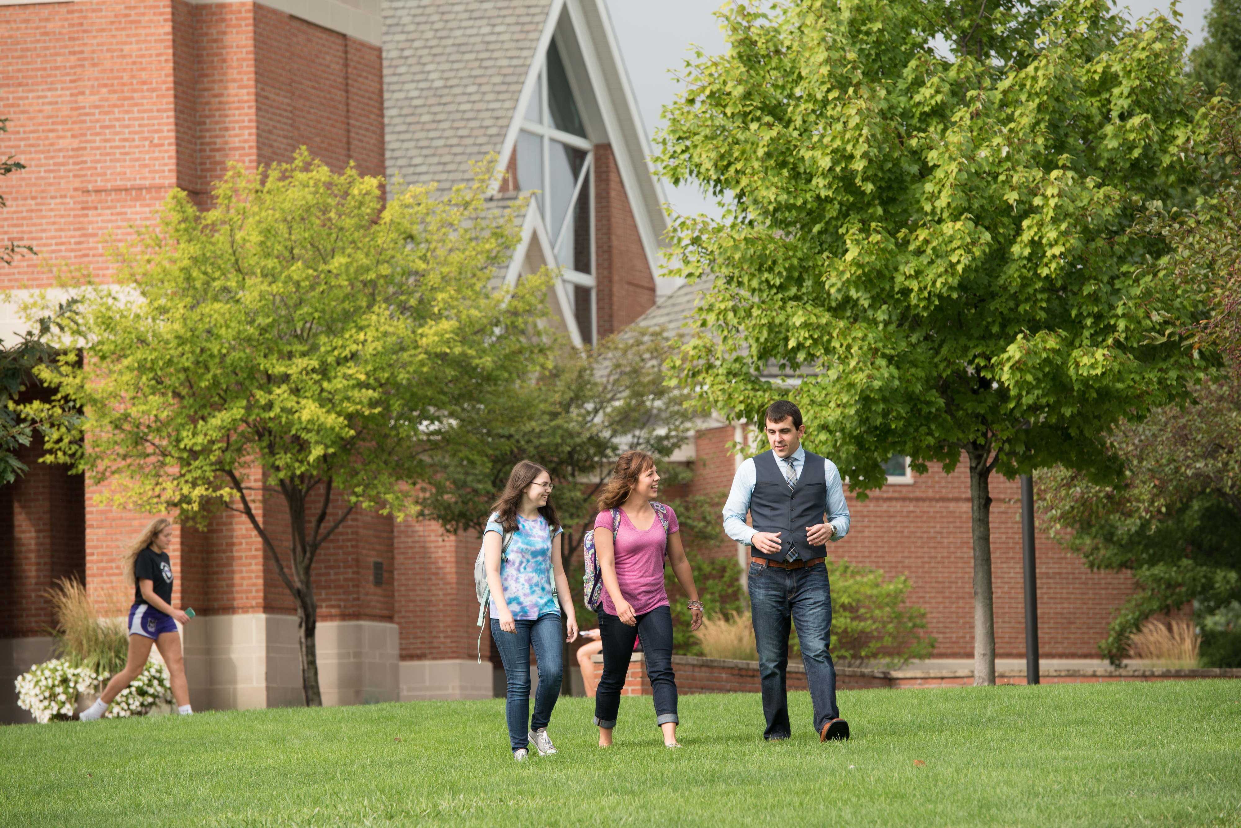 professor walking with students 